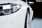 IND exterior painted front reflector set for BMW F8X M3 and M4 models, showing close-up of sleek, painted reflector components.