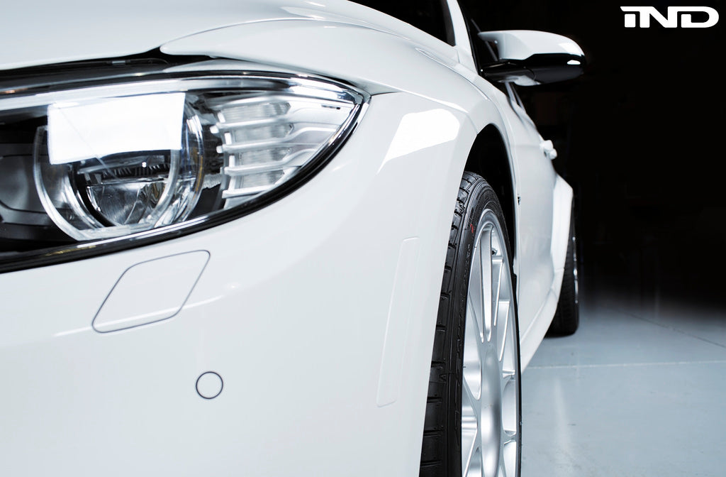 IND exterior painted front reflector set for BMW F8X M3 and M4 models, showing close-up of sleek, painted reflector components.