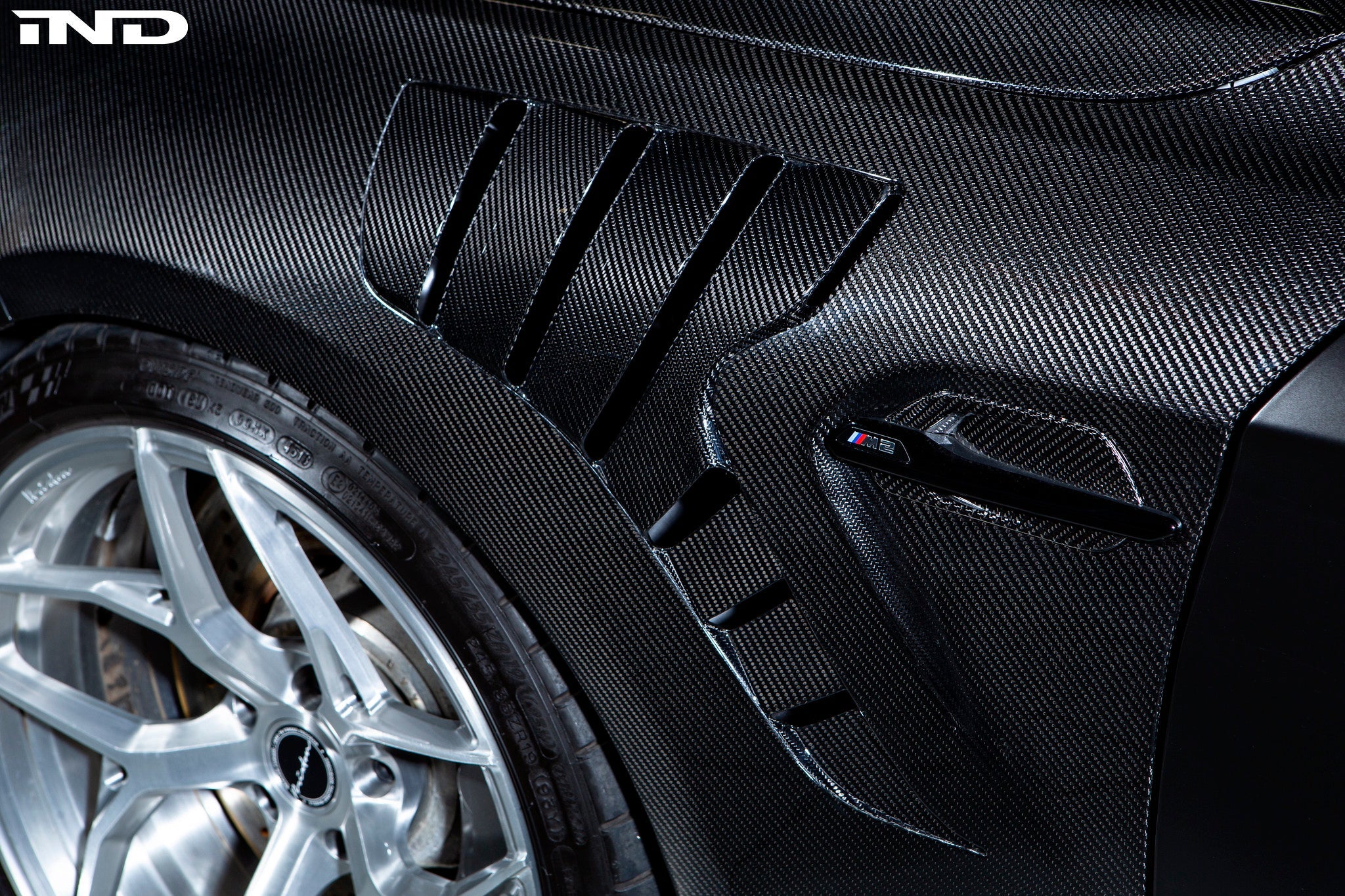 Alpha-N carbon fiber fenders installed on BMW F87 M2 with vent inserts