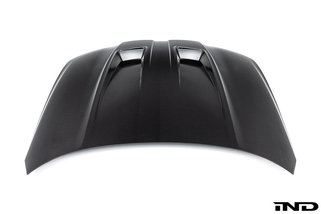 Alpha N G8X M3 M4 carbon fiber vented hood with raw finish, showcasing the lightweight exterior upgrade for BMW M models.