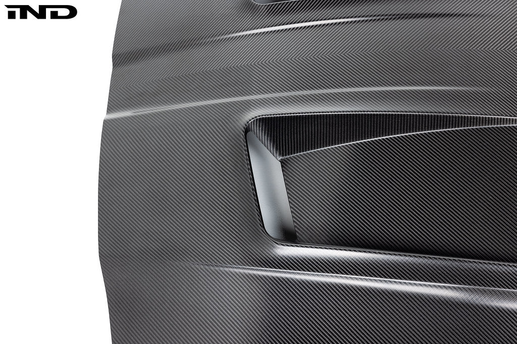 Alpha N G8X M3 M4 carbon fiber vented hood with raw finish, showcasing its lightweight, aerodynamic exterior design.
