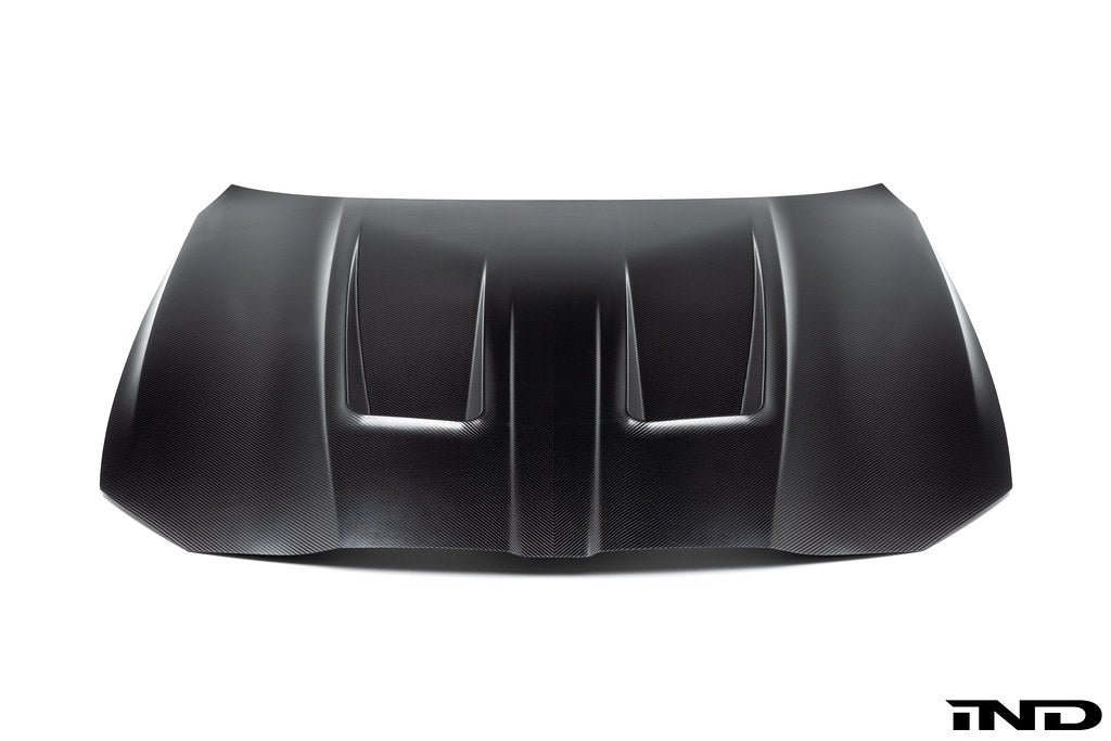 Alpha N G8X M3 M4 carbon fiber vented hood in raw finish, showing its lightweight, aerodynamic exterior design.