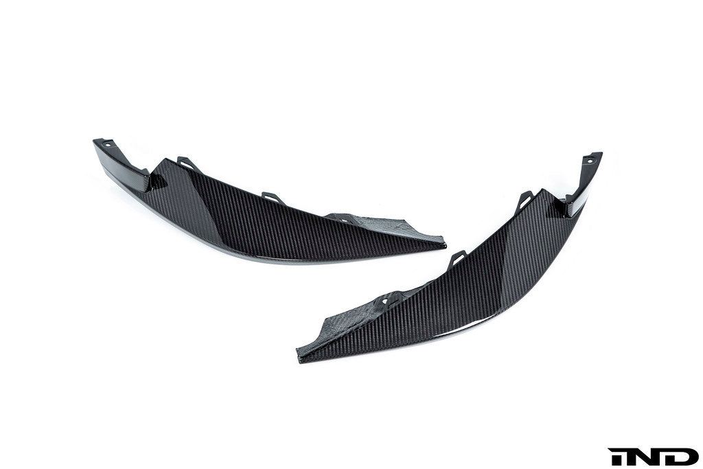 Alpha N G8X M3 M4 carbon front corner splitter set installed on vehicle, showing sleek white finish and aerodynamic design.