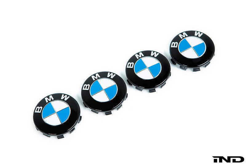 IND Gloss Black Wheel Center Cap Set for BMW, 56mm, featuring a sleek black finish and painted white background.