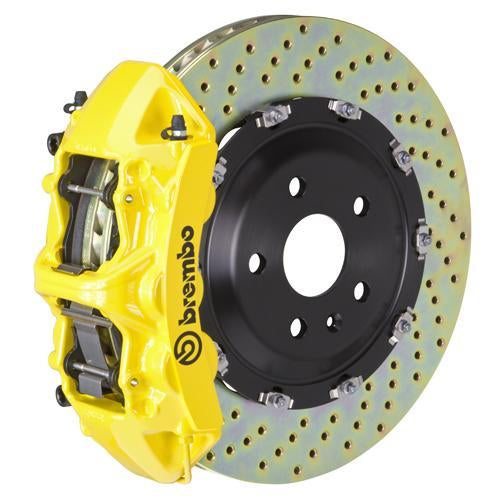Brembo F8X M2/M3/M4 GT big brake kit with yellow 6-piston calipers and 365x34mm 2-piece drilled front rotors.