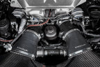 Eventuri black carbon intake system installed in engine bay of Audi C8 RS6 and RS7, showcasing performance air intake components.