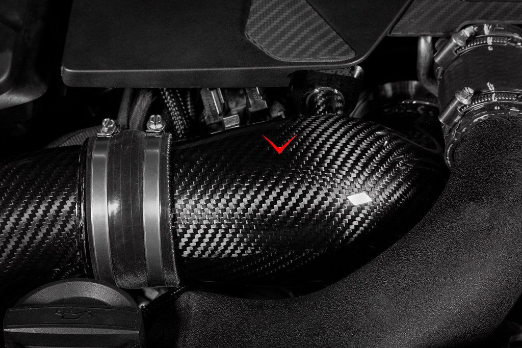 Eventuri BMW F90 M5 and F9X M8 carbon turbo inlet set installed in engine bay, showcasing high-performance automotive parts.