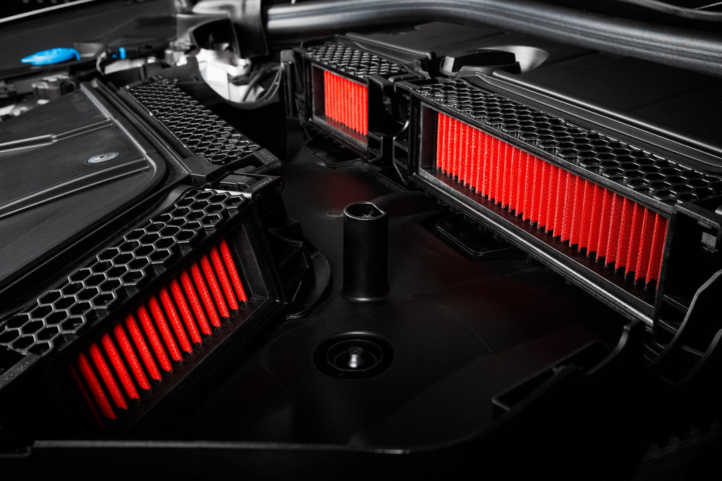 Eventuri BMW F97 X3M / F98 X4M replacement panel filter set installed, showcasing high-performance filters inside engine bay.