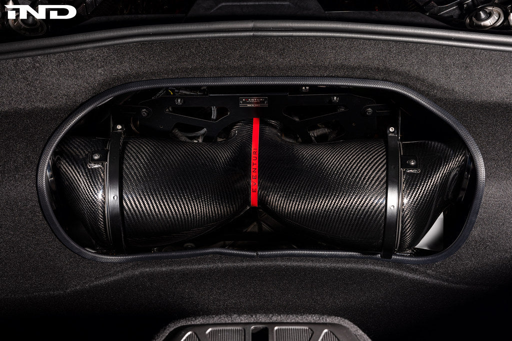 Eventuri carbon fiber intake system installed in a Chevrolet C8 Corvette Coupe with clear trunk panel