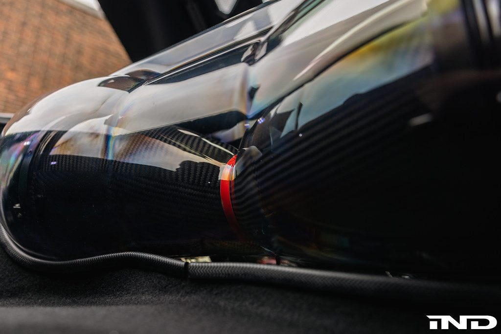 Eventuri carbon fiber intake system installed in a Chevrolet C8 Corvette Coupe with clear trunk panel