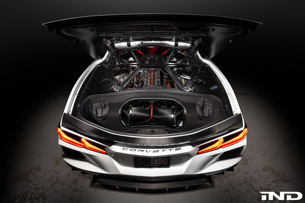 Eventuri carbon fiber intake system installed in a Chevrolet C8 Corvette Coupe with clear trunk panel