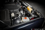 Installed side view of Eventuri BMW E39 M5 carbon intake system in the engine bay