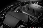Eventuri black carbon intake system installed in BMW E9X M3 S65 engine bay, showcasing performance air intake components.
