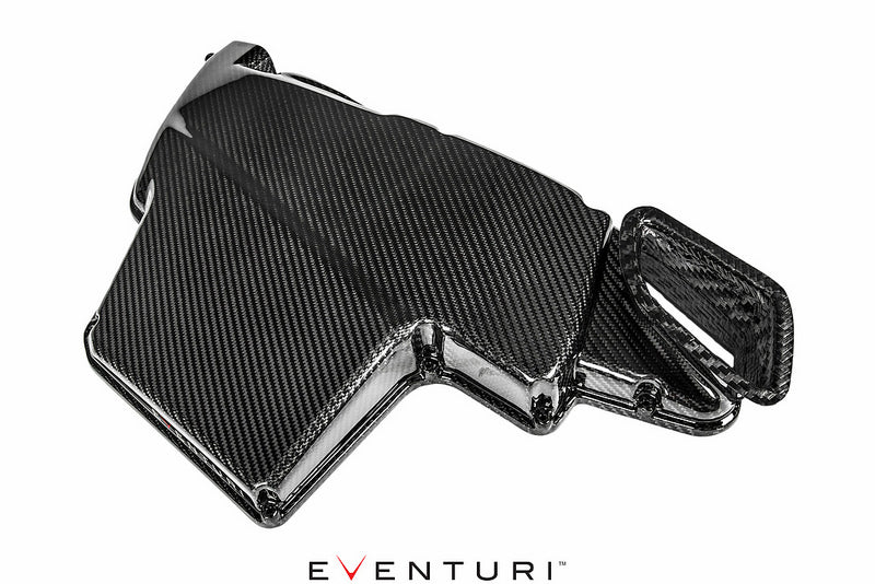 Eventuri black gloss carbon airbox lid for BMW E9X M3 S65 engine, showcasing a sleek, high-performance automotive component.