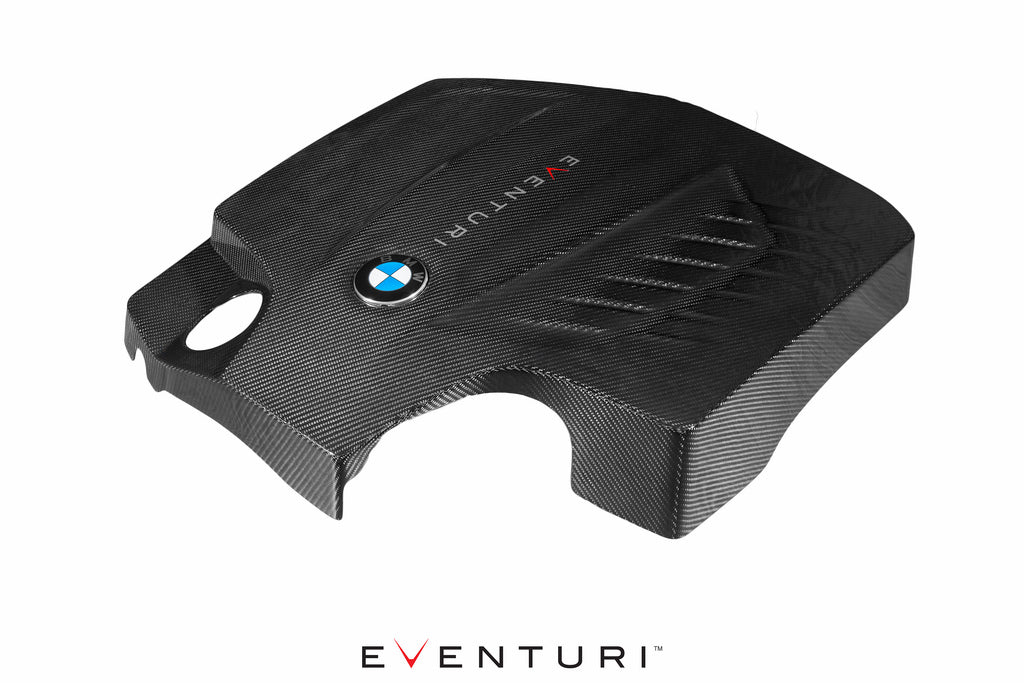 Eventuri black carbon engine cover for BMW F-Chassis N55, front-angle view showing sleek performance design.