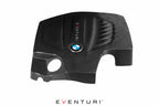 Black carbon engine cover for BMW F-Chassis with N55 engine, designed by Eventuri, showcasing a sleek performance upgrade.