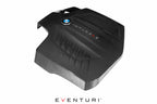 Eventuri black carbon engine cover for BMW F-Chassis N55, overhead rear view showing performance automotive design.
