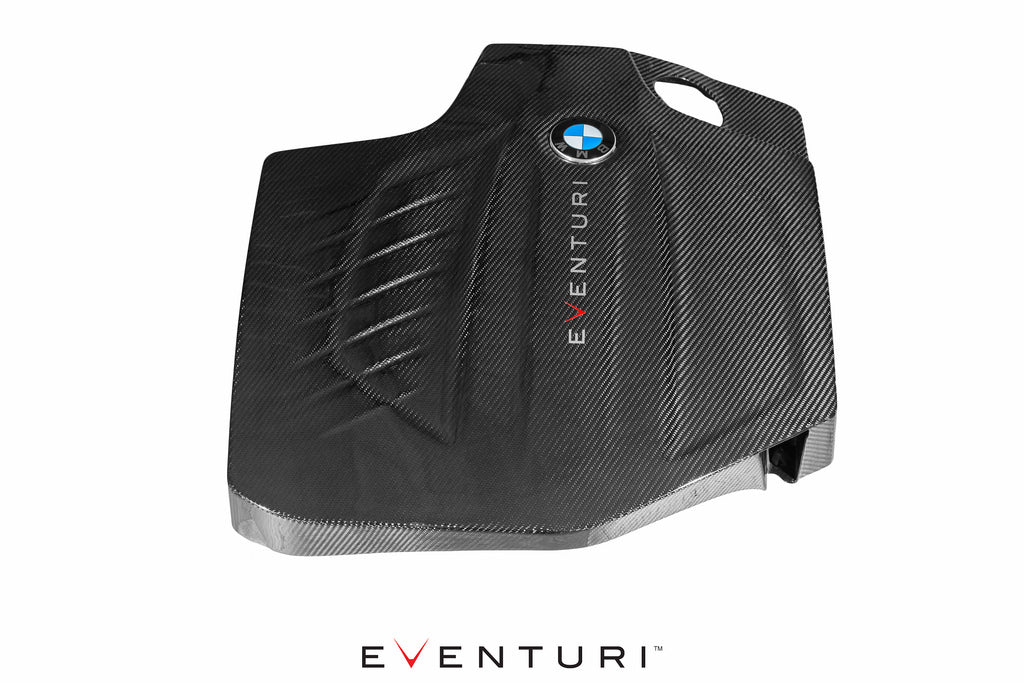 Eventuri black carbon engine cover for BMW F-Chassis N55, performance car engine upgrade with sleek rear view.