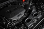 Eventuri F56 Mini Cooper S plastic intake with carbon scoop installed in engine bay, showcasing performance air intake system.