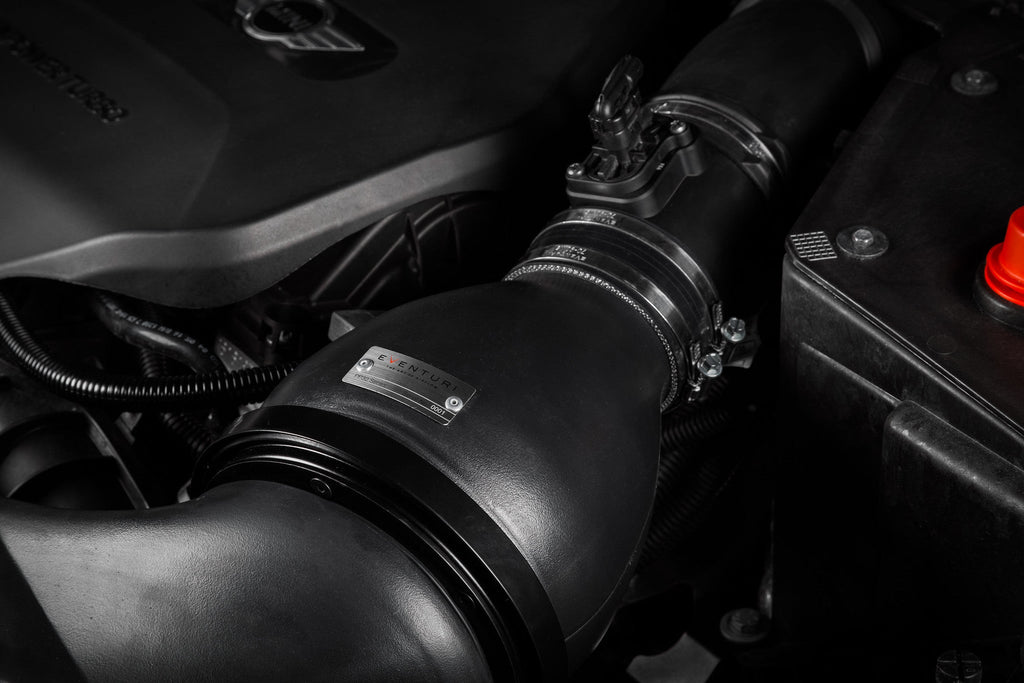 Eventuri F56 Mini Cooper S plastic intake and carbon scoop installed in engine bay, showcasing performance upgrade components.