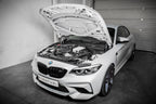 Eventuri black carbon intake system installed on BMW F87 M2 Competition and M2 CS, showcasing high-performance engine components.