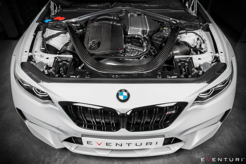 Eventuri black carbon intake system installed on BMW F87 M2 Competition and M2 CS, showcasing performance upgrade and sleek design.