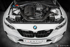 Eventuri black carbon intake system installed on BMW F87 M2 Competition and M2 CS, showcasing performance upgrade and sleek design.