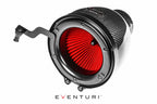 Eventuri black carbon intake system for BMW F87 M2 Competition and M2 CS with performance design and white engine bay background.
