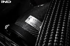 Eventuri black carbon intake system installed in engine bay of BMW F8X M3 and M4 with S55 engine, performance upgrade.