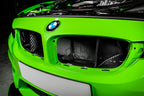 Eventuri black carbon intake system installed in engine bay of BMW F8X M3 and M4 S55 performance engine.