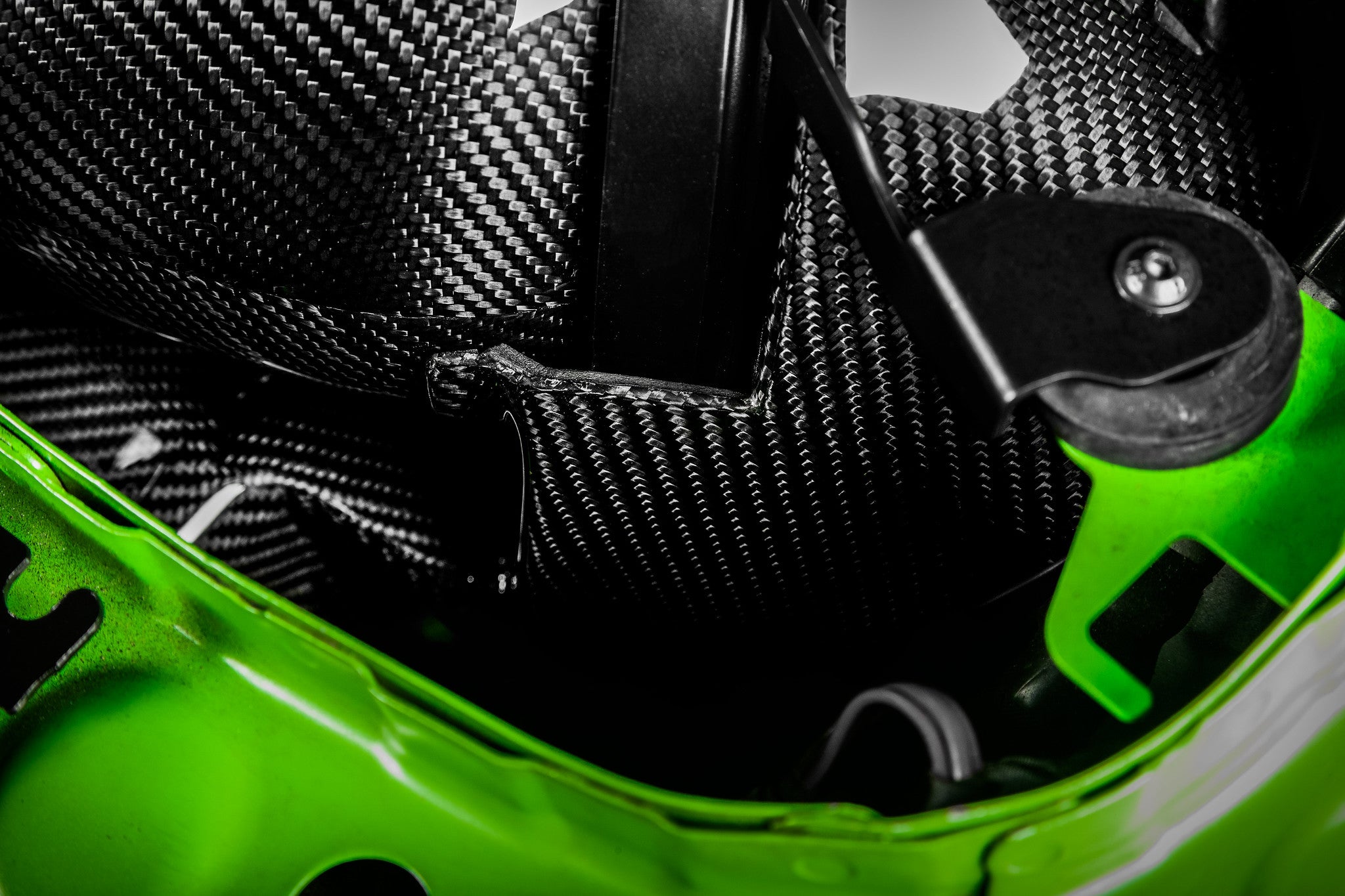 Eventuri black carbon intake system installed in engine bay for BMW F8X M3 and M4 S55 performance engine.