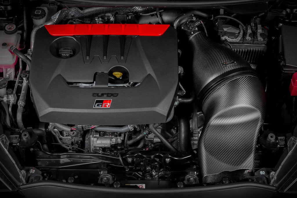Eventuri GR Yaris carbon intake system installed, showcasing matte carbon fiber performance air intake for enhanced engine airflow.