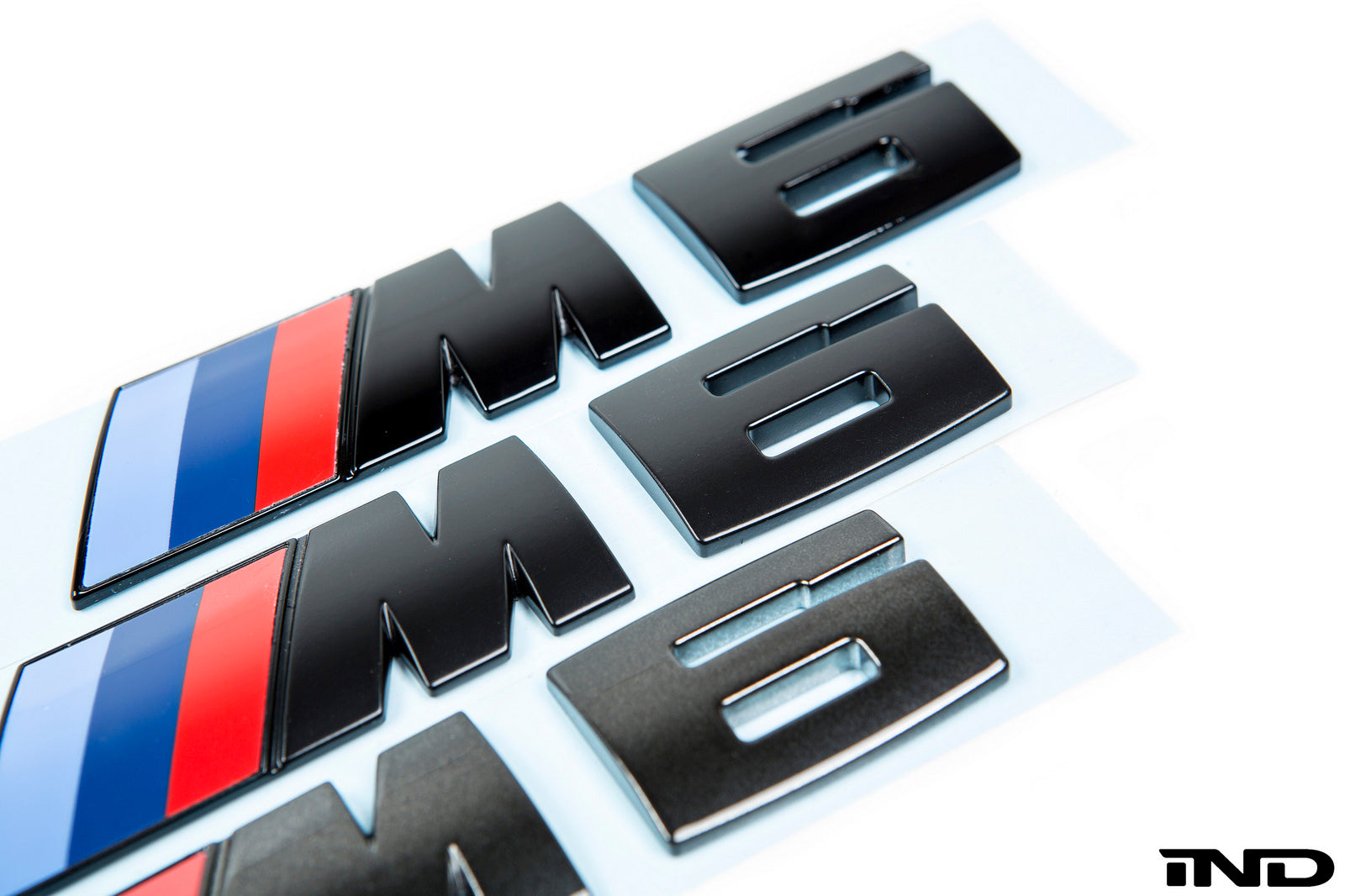 iND f06 f12 f13 m6 painted trunk emblem - iND Distribution