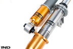 Ohlins E9X M3 coilover suspension system with adjustable shocks and springs for improved road and track performance.