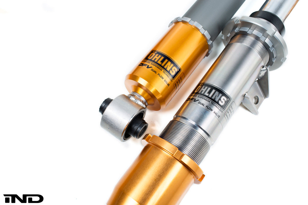 Ohlins E9X M3 coilover suspension system with adjustable shocks and springs for improved road and track performance.