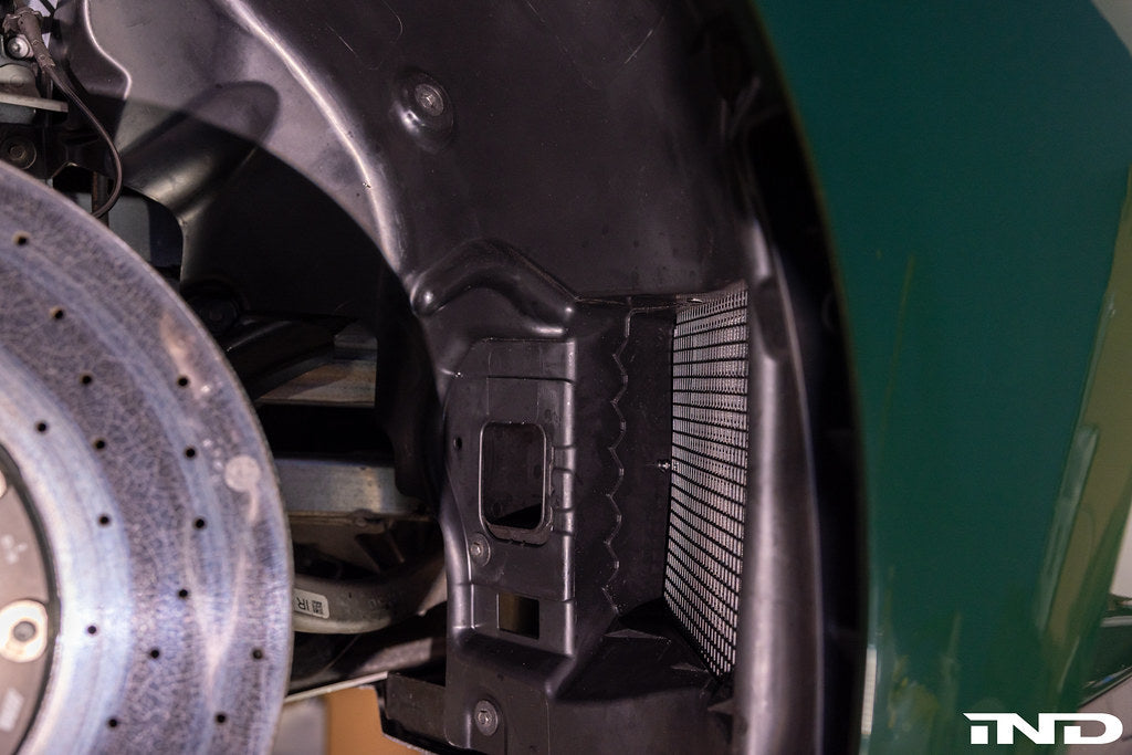 RKP G8X M2, M3, M4 enhanced clearance front liner set installed on vehicle with wheel spacers for improved fitment.